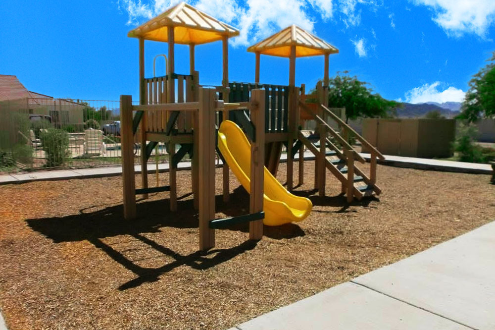 This image displays exterior photo of Las Casas de Quartzsite Apartments