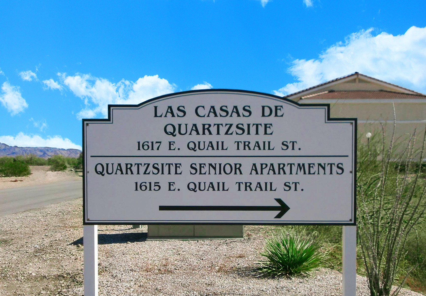 This image displays entrance marker photo of Las Casas de Quartzsite Apartments